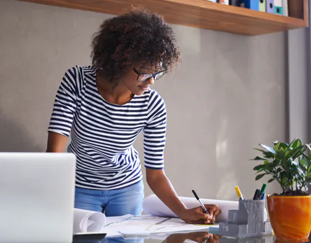 Young designer sketching at a desk